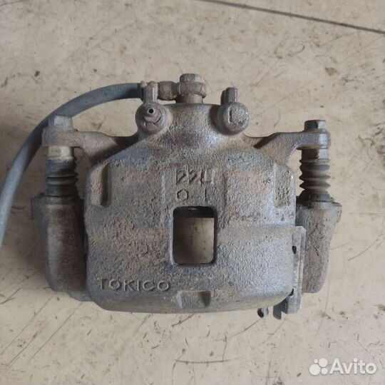 Суппорт тормозной передний левый mitsubishi L200