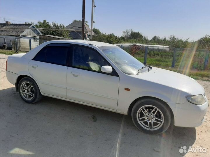 Mazda Familia 1.5 AT, 2000, 399 400 км