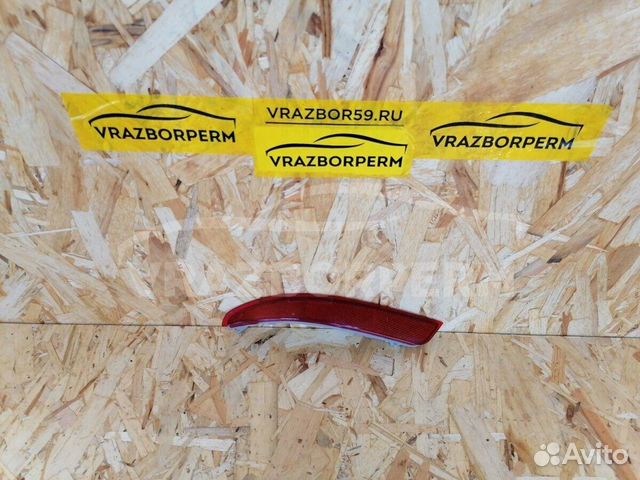 Отражатель в бампер задний левый Nissan Almera