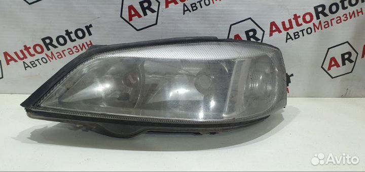 Фара галогеновая левая Opel Astra седан