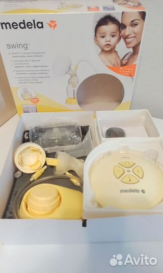 Молокоотсос medela swing + подушка для кормления