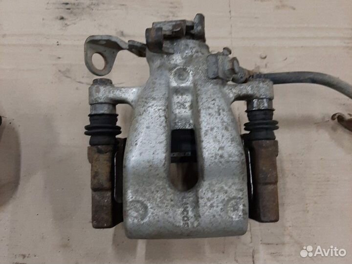 Суппорт тормозной Opel Astra H G Zafira A B