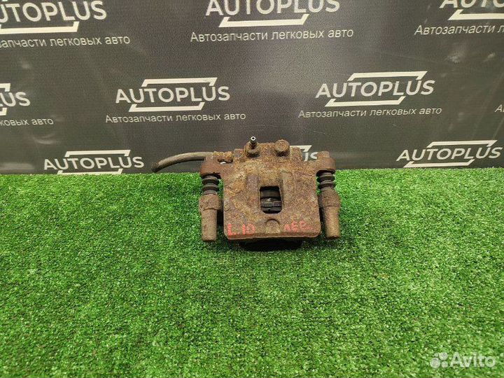 Суппорт задний левый Mitsubishi Lancer X седан 1.8