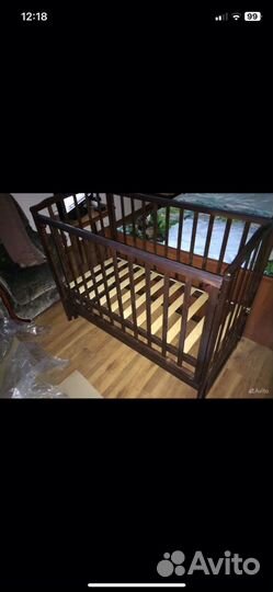 Детская кроватка с продольным маятником