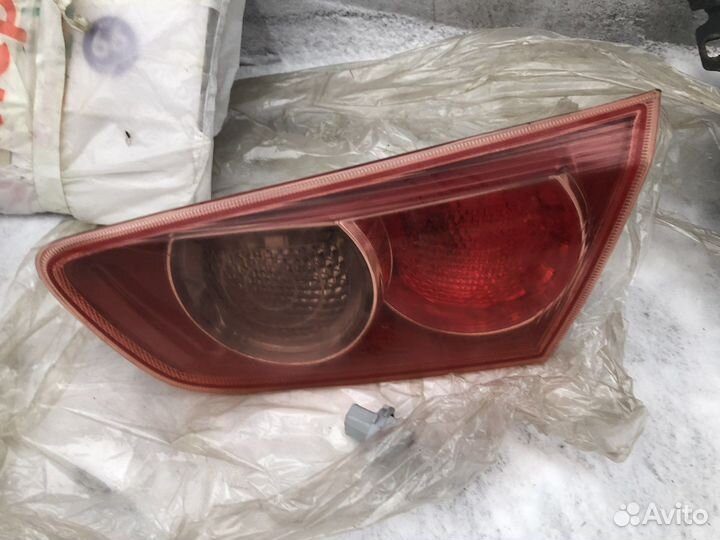 Задний фонарь ориг. в крышку багажника Лансер 10