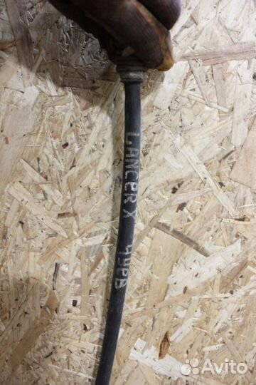 Трос стояночного тормоза Mitsubishi Lancer 10