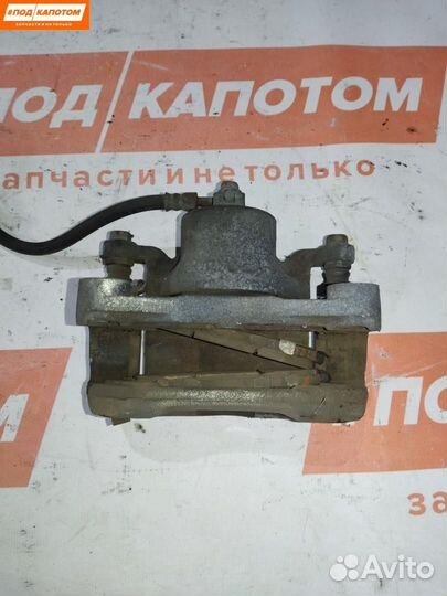 Суппорт тормозной передний левый Nissan Teana J32