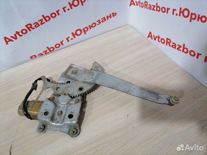 Стеклоподъемник задний левый Mazda Familia 03г.в