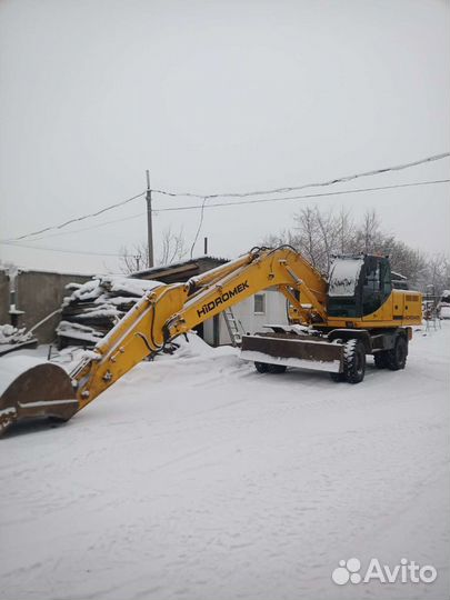 Услуги колесного экскаватора с гидромолотом