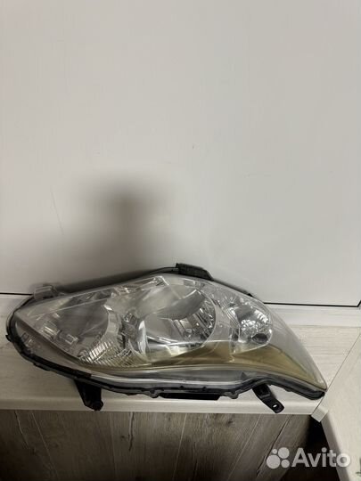 Фара левая для toyota corolla 150