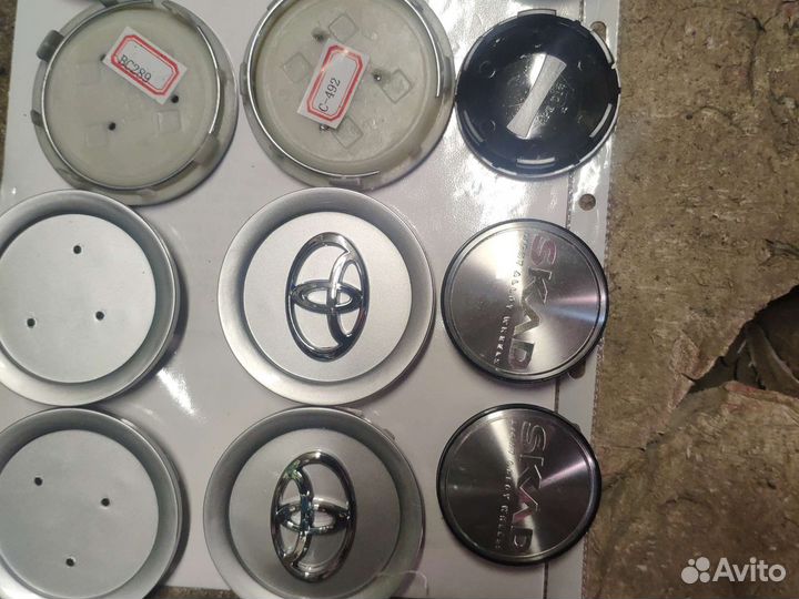 Эмблемы, колпачки для колес