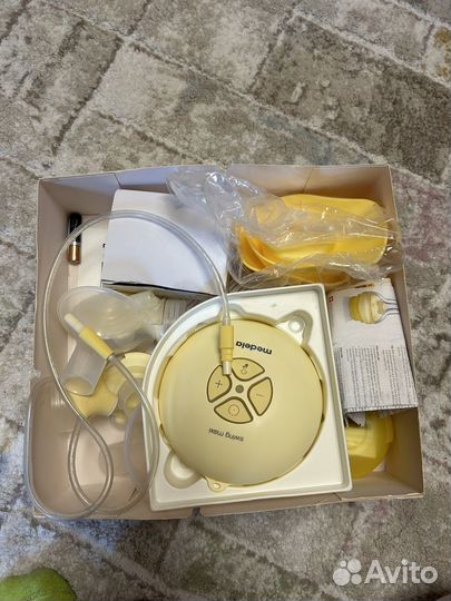 Молокоотсос Medela swing maxi