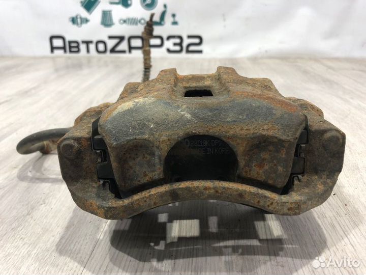 Суппорт тормозной передний правый Kia Rio G4EE