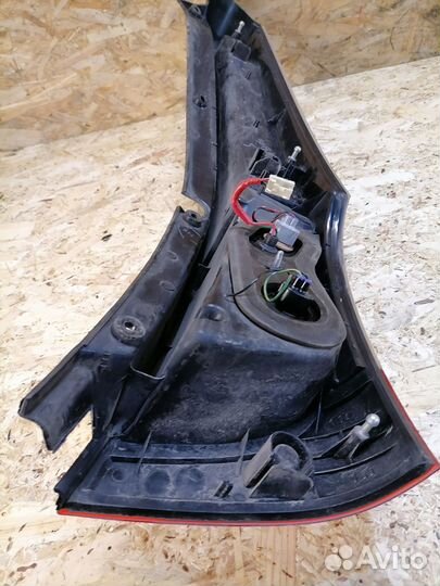 Фонарь левый Mitsubishi Grandis NA4W