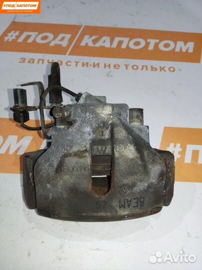 Суппорт тормозной передний левый Volkswagen Passat