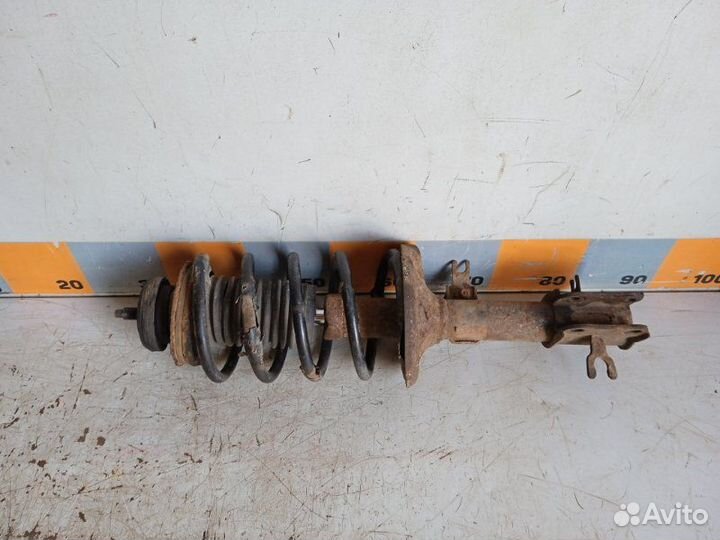 Амортизатор передний левый Chevrolet Aveo T250 1.2