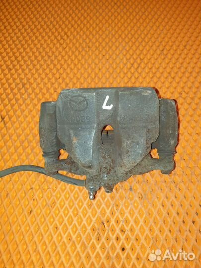 Суппорт тормозной передний левый Mazda 6 GJ