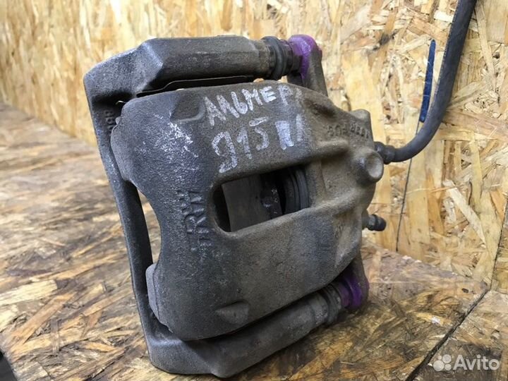 Суппорт тормозной передний левый Nissan Almera G15