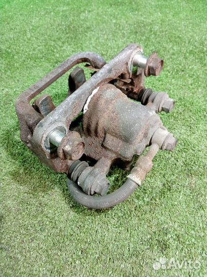 Суппорт тормозной задний левый Nissan X-Trail NT31