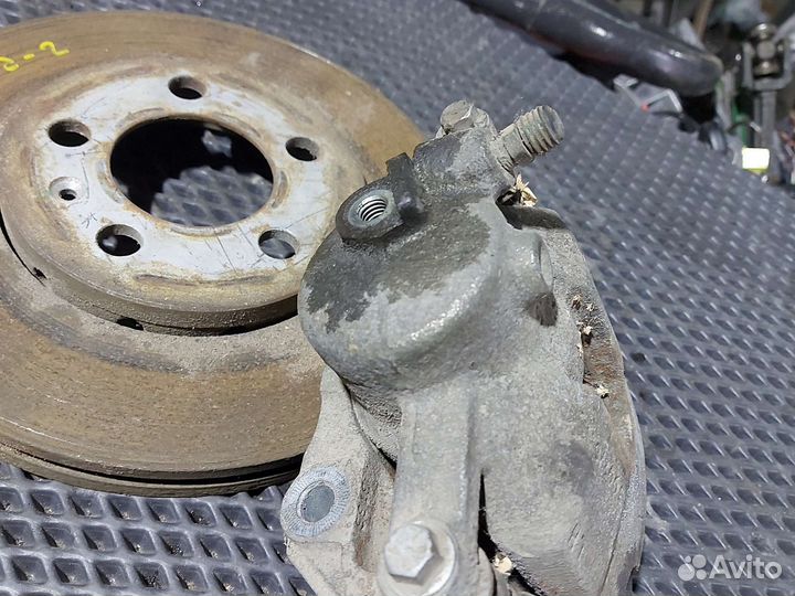 Суппорт тормозной передний левый Skoda Fabia II