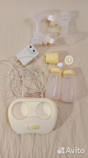Молокоотсос medela электрический