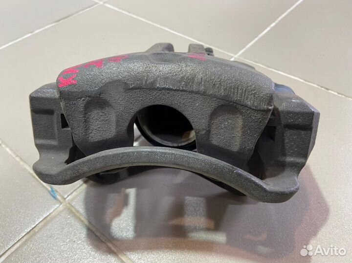 Суппорт передний левый Kia Sportage 2008