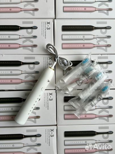 Электрическая зубная щетка