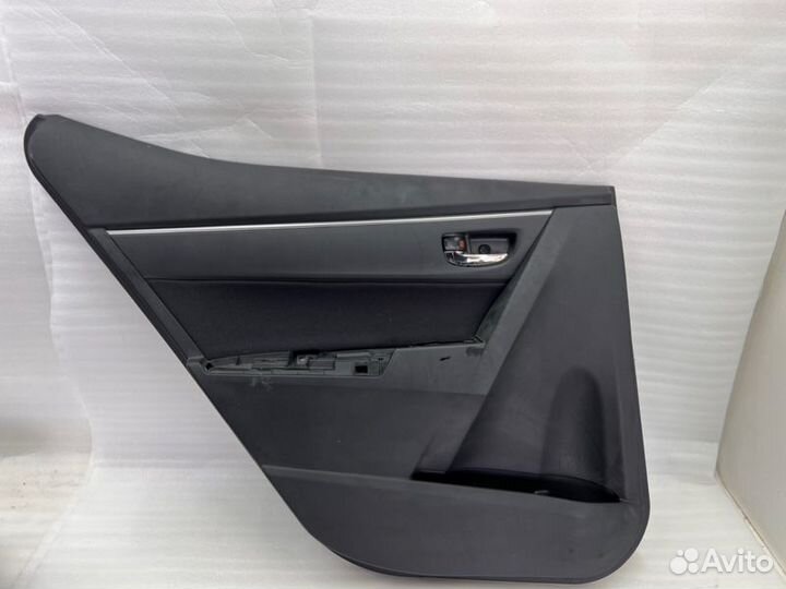 Обшивка двери задняя левая Toyota Coroiia