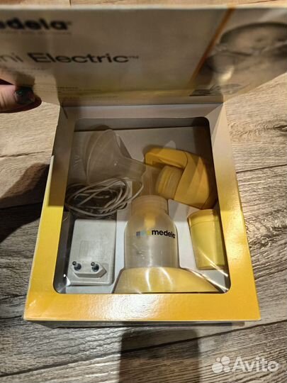 Молокоотсос medela электрический
