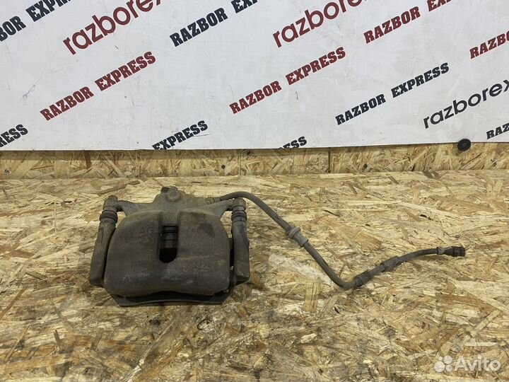 Суппорт тормозной передний левый Skoda Octavia A7