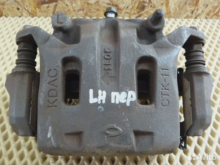 Суппорт передний левый Renault Koleos (HY) 2008-2016 (41011JY00A)