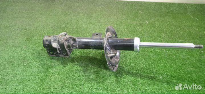 Амортизатор передний левый Nissan Micra K12E