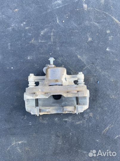 Суппорт тормозной передний левый VW Polo