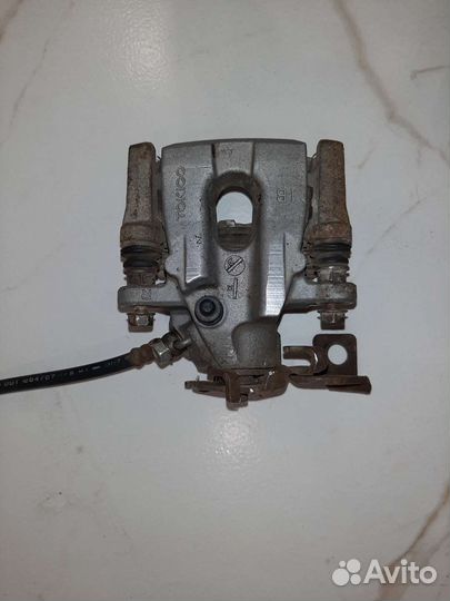 Суппорт задний правый toyota corolla е 150