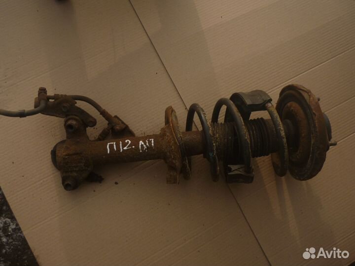 Стойка передняя левая Nissan Primera P12