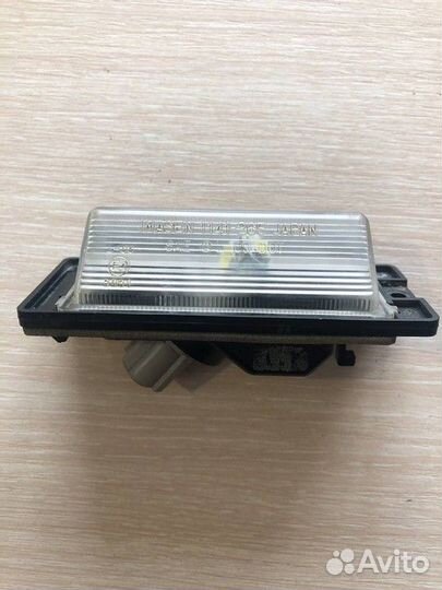 Фонарь подсветки номера Mitsubishi Lancer