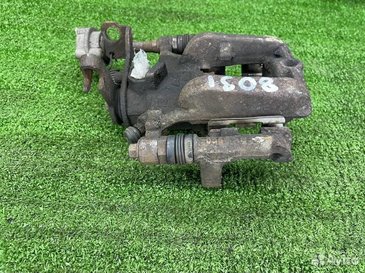 Суппорт тормозной задний левый Opel Astra J GTC