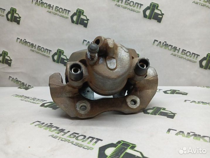 Суппорт тормозной передний левый Ford Focus