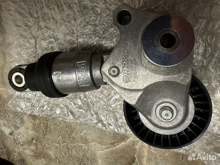 Ролик и ремень натяжителя генератора Mazda CX5