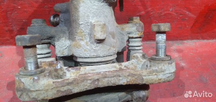 Суппорт задний левый Nissan Almera N16 Альмера