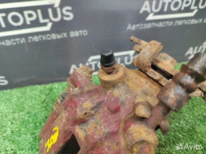 Суппорт тормозной задний правый Nissan Almera Tino