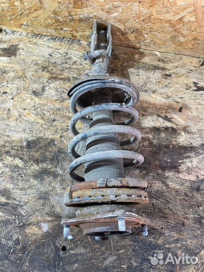 Стойка передняя левая Киа Спектра