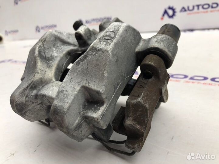 Суппорт тормозной задний левый Mercedes C-Class