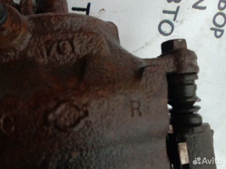 Суппорт передний правый Nissan Almera N15