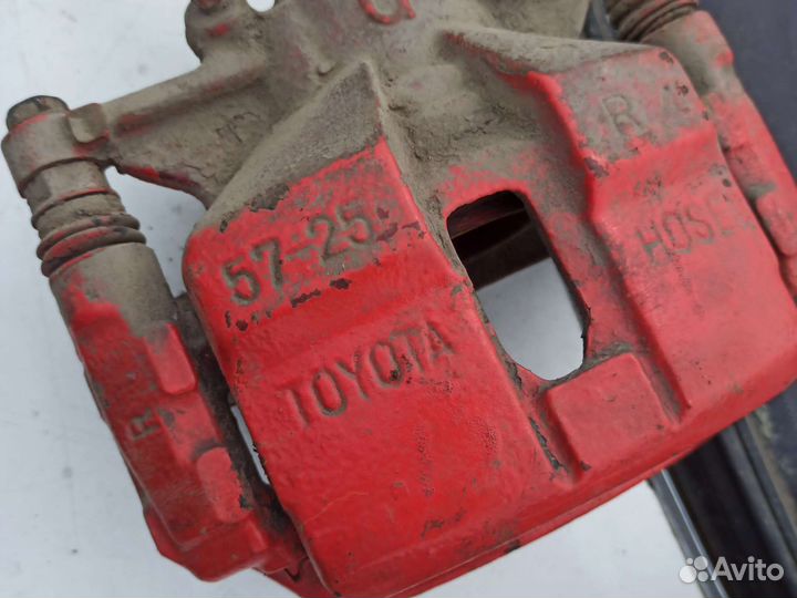 Суппорт тормозной пер. ST-215 Corona premio