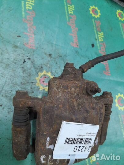 Суппорт передний левый Nissan Cefiro