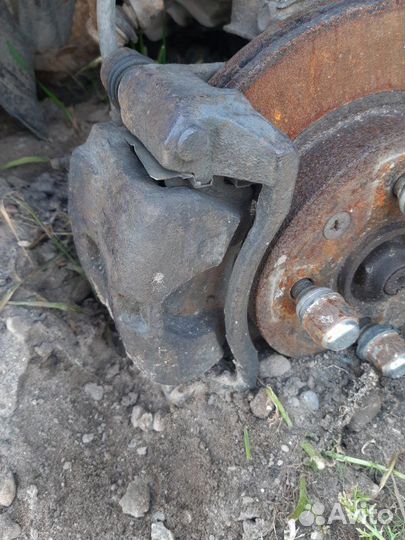 Суппорт тормозной передний левый Kia Rio универсал