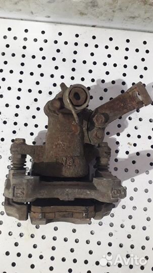 Суппорт тормозной задний левый Suzuki SX4