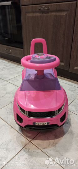 Машинка каталка музыкальная