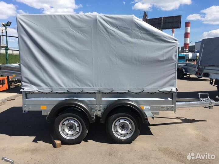 Легковой двухосный прицеп с высоким тентом